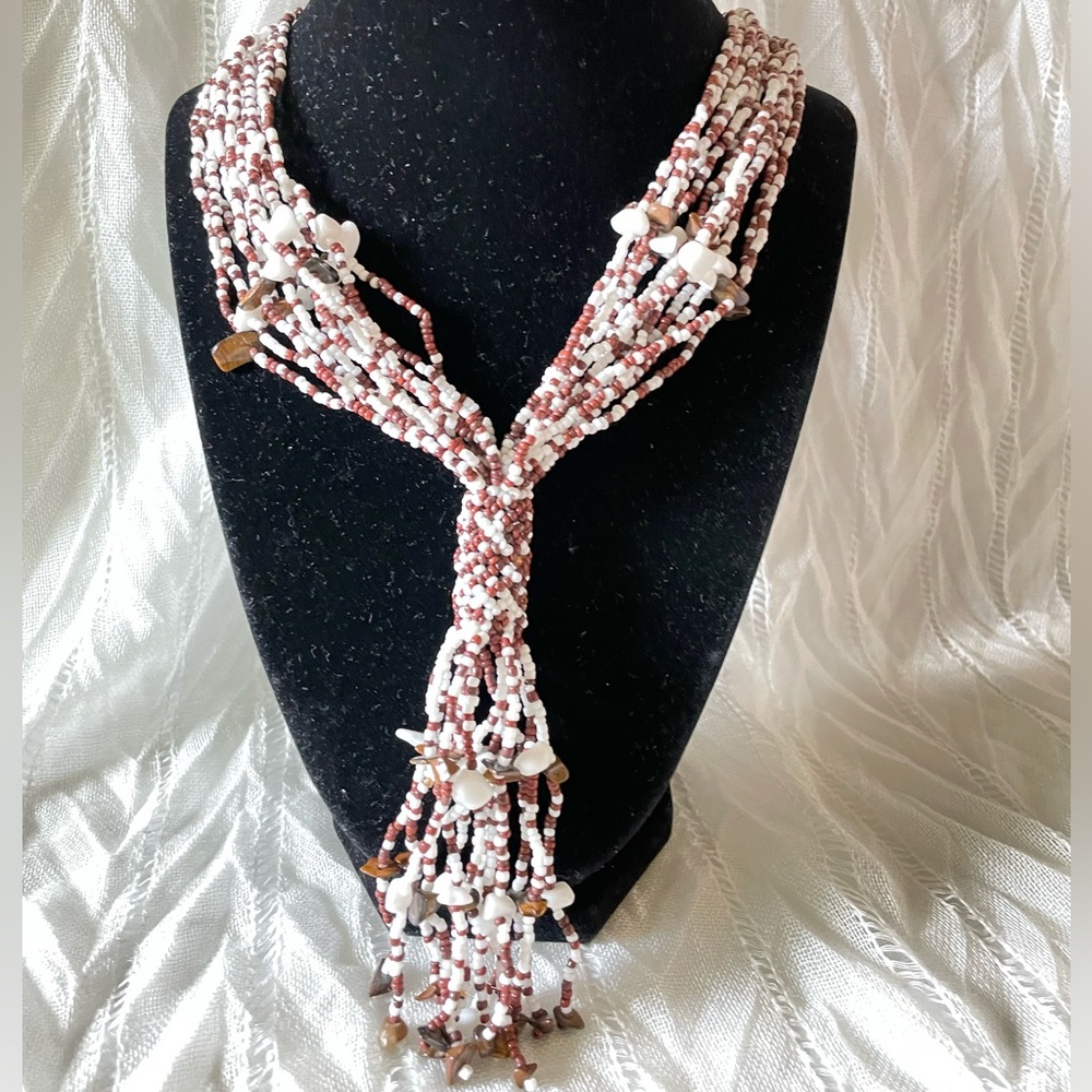 Multi strands brown and white seeds beads tubular tassel with adjustable button